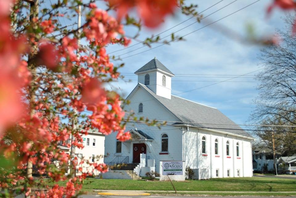 Sozo church building with spring blossoms