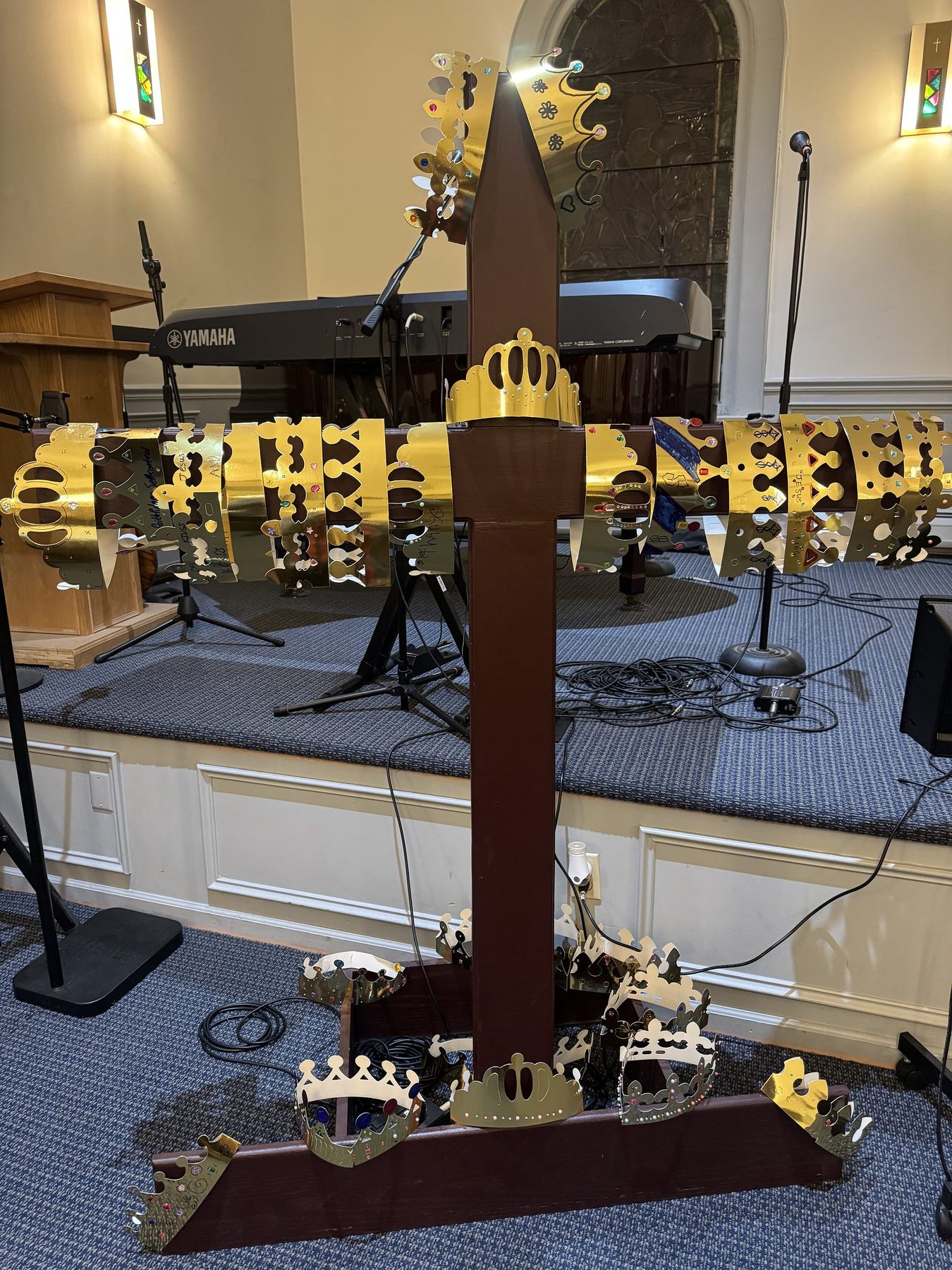The sanctuary cross hung with gold crowns